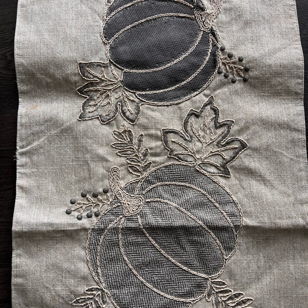 Beige and silver table runner.